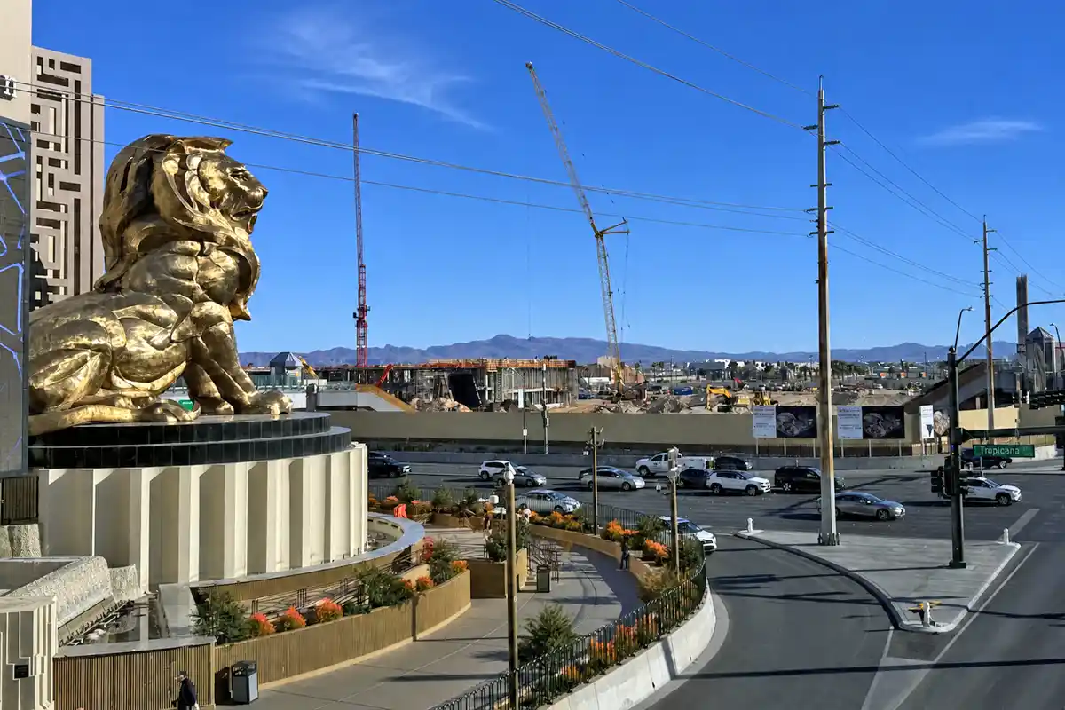 MGM Grand lion statue overlooking construction near the future Athletics ballpark site in Las Vegas.