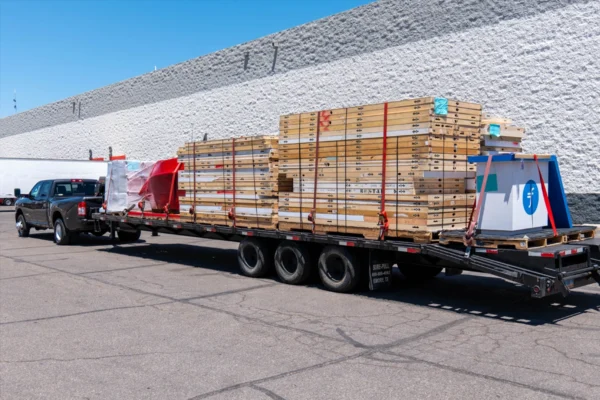 Trailer loaded with reusable exhibit wall panels donated by Absolute Exhibits in Las Vegas