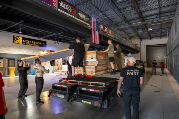 Law enforcement personnel unload donated exhibit wall panels at the Joint Emergency Training Institute in Las Vegas