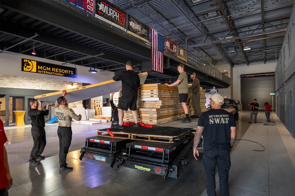 Law enforcement personnel unload donated exhibit wall panels at the Joint Emergency Training Institute in Las Vegas