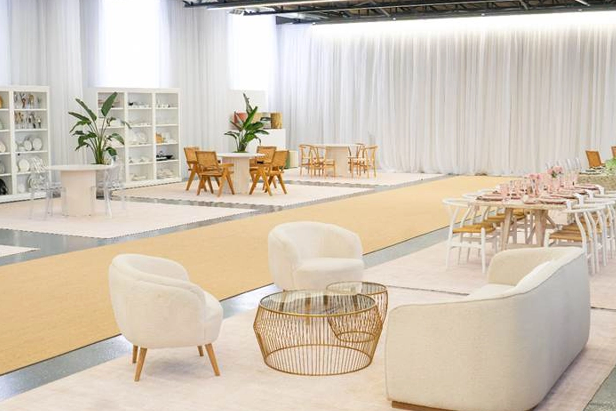 Element Event Solutions showroom with lounge furniture, table settings, drapery, and rental displays.
