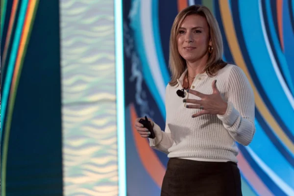 Liz Nacron speaks onstage during a corporate event