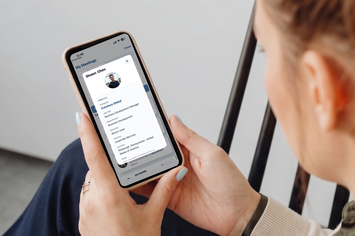 Person views a MatchPoint meeting profile on a smartphone.