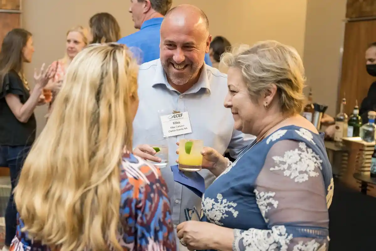 ECEF 25th anniversary attendees networking at the event