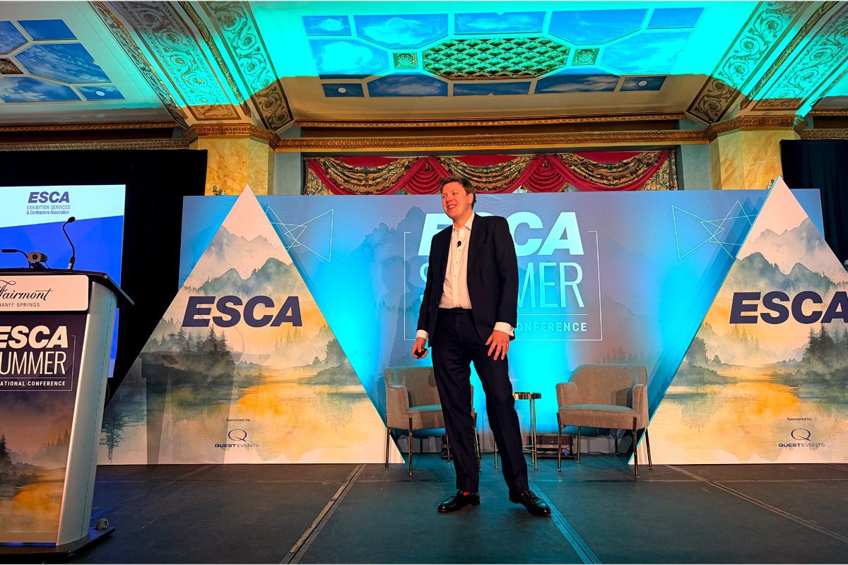 Alexander Easdale speaks onstage during the ESCA Summer Educational Conference in Banff.