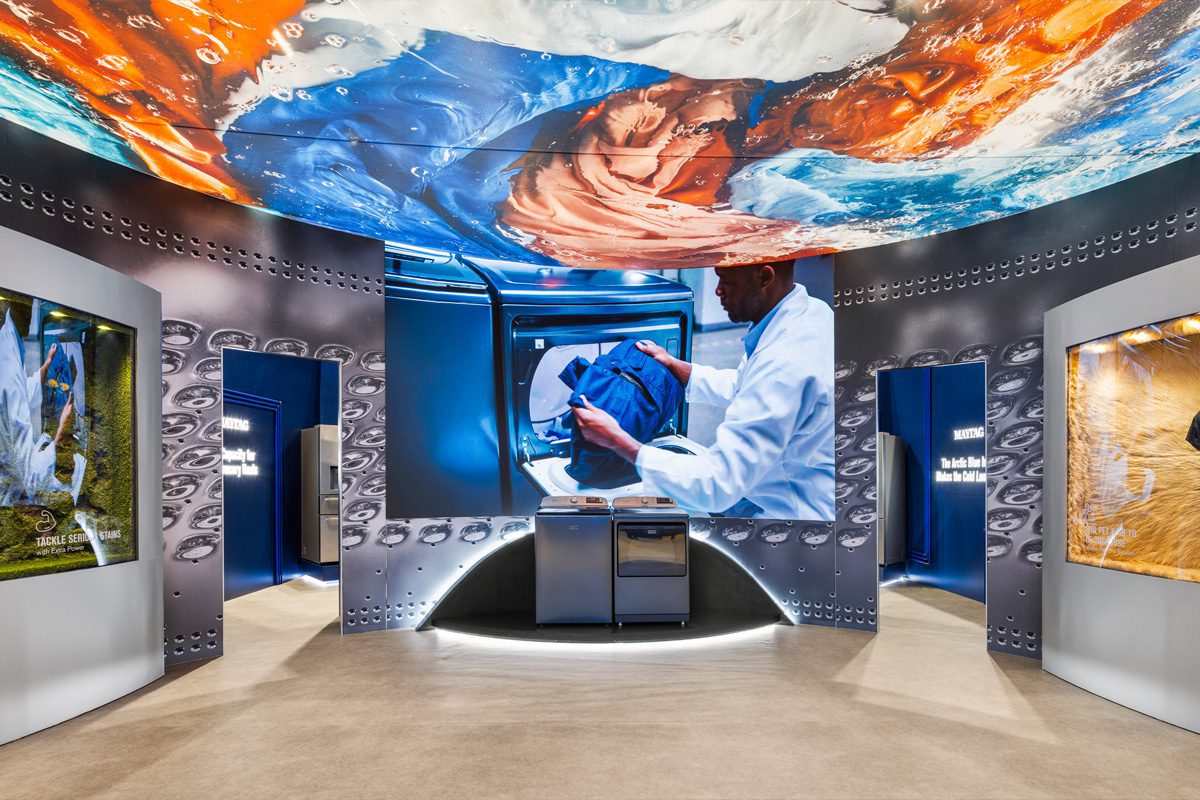 Whirlpool KBIS 2026 exhibit with immersive graphics, LED lighting, and appliance displays.