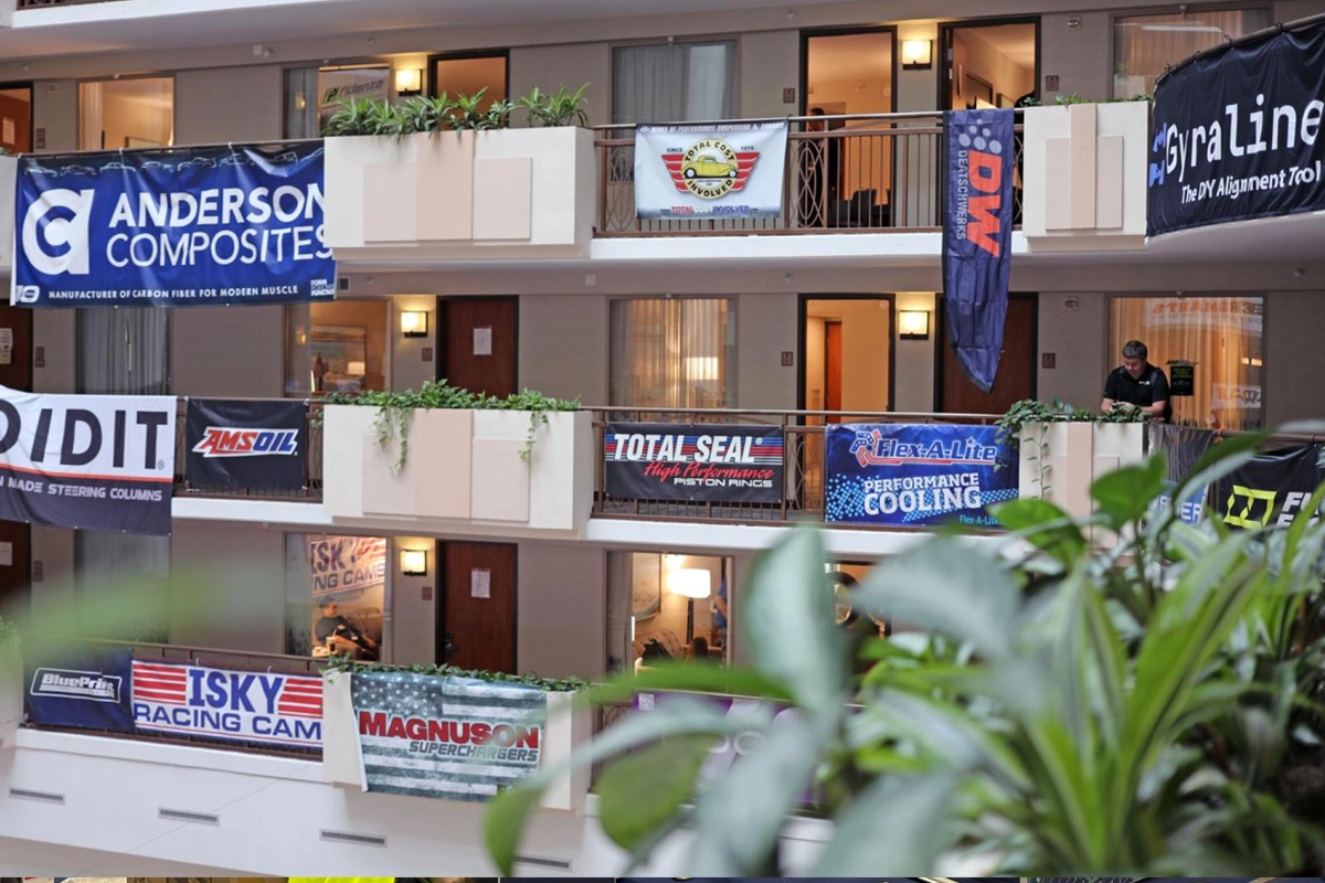 Motorsports manufacturer banners displayed throughout the 2025 MPMC Media Trade Conference venue
