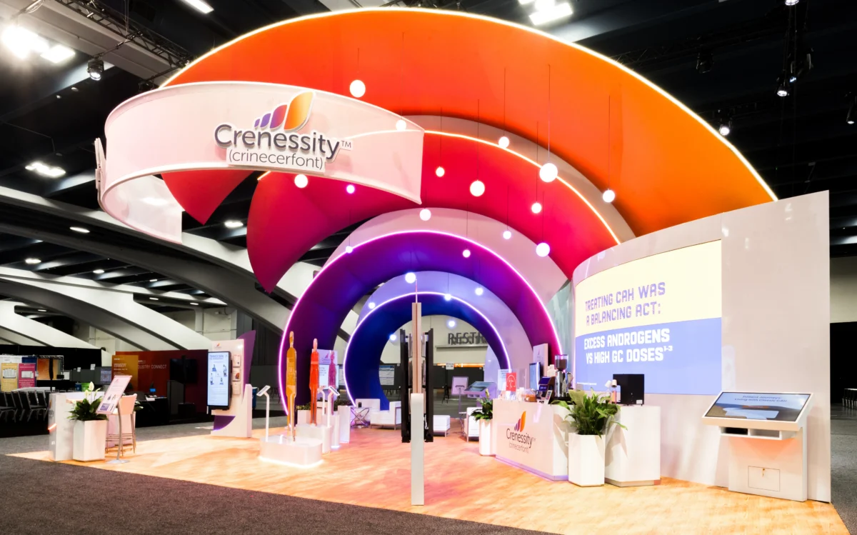 Neurocrine Biosciences medium rental exhibit with layered arches, suspended lighting, and interactive displays