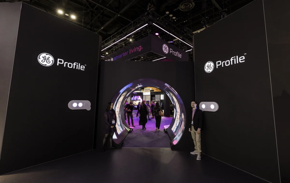 GE Profile large rental exhibit with dark branded walls and an illuminated circular entrance