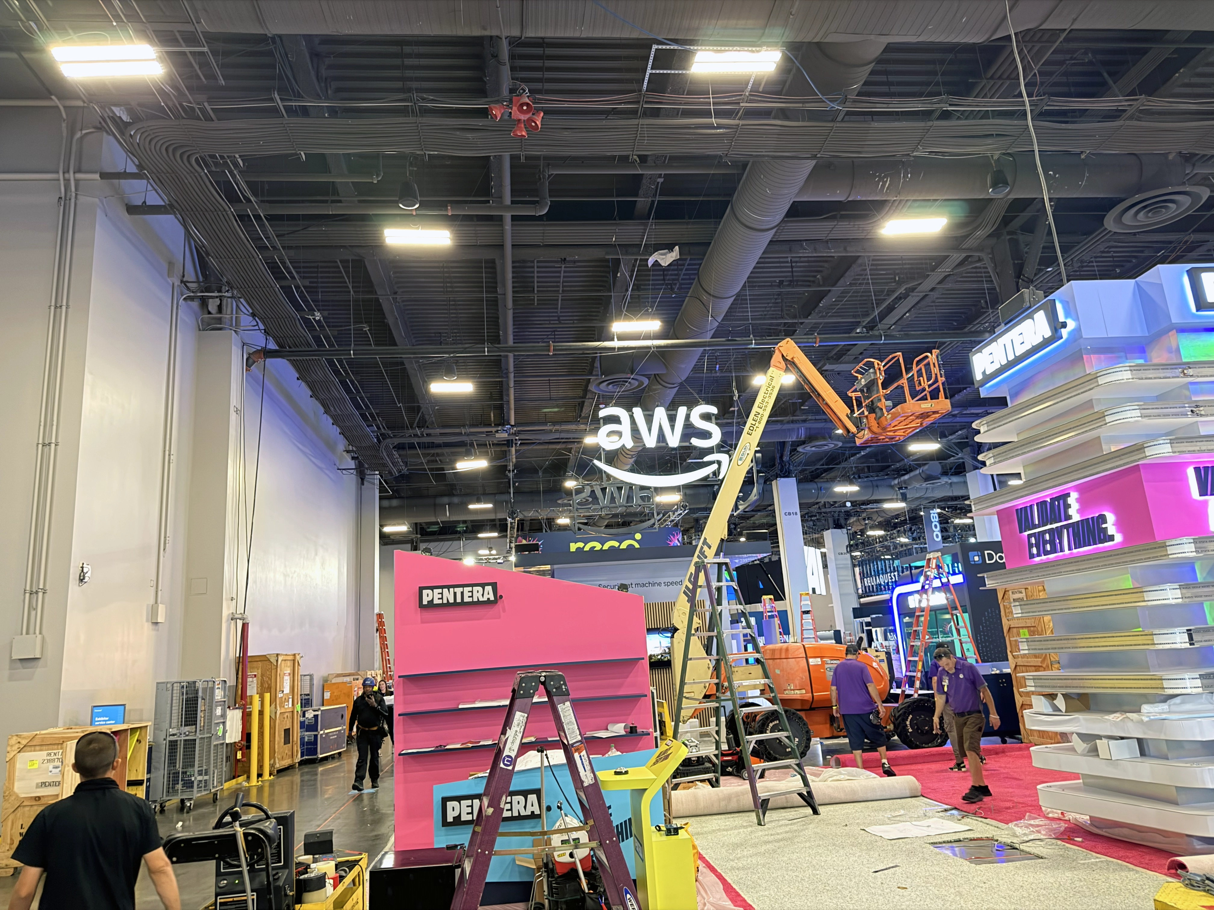Crews install exhibits and signage during move-in for Black Hat USA 2026 at Mandalay Bay