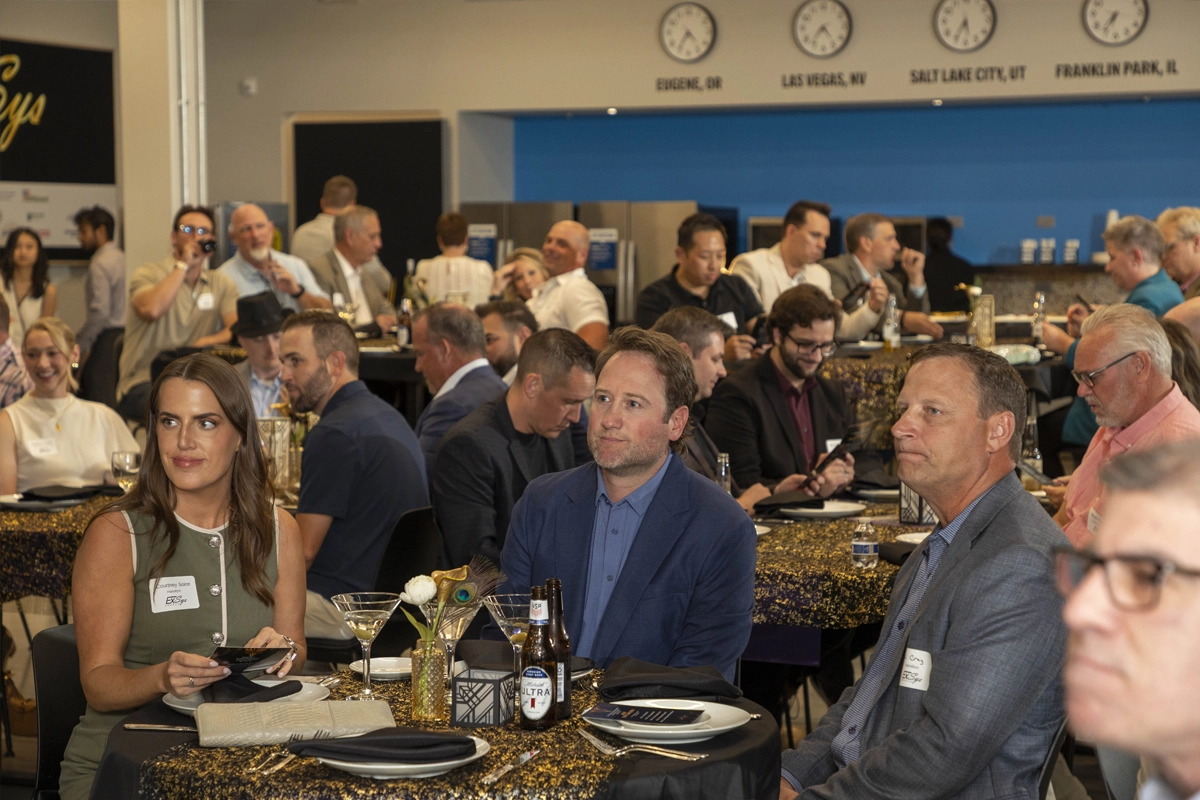 Guests seated at tables during the Forecasting the Future panel at the 2026 ExSys Awards.