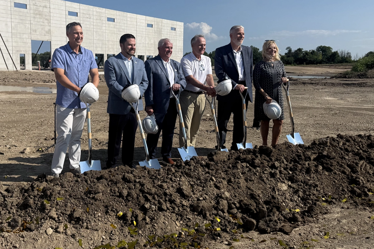Six representatives pose during the Derse Oak Creek headquarters groundbreaking
