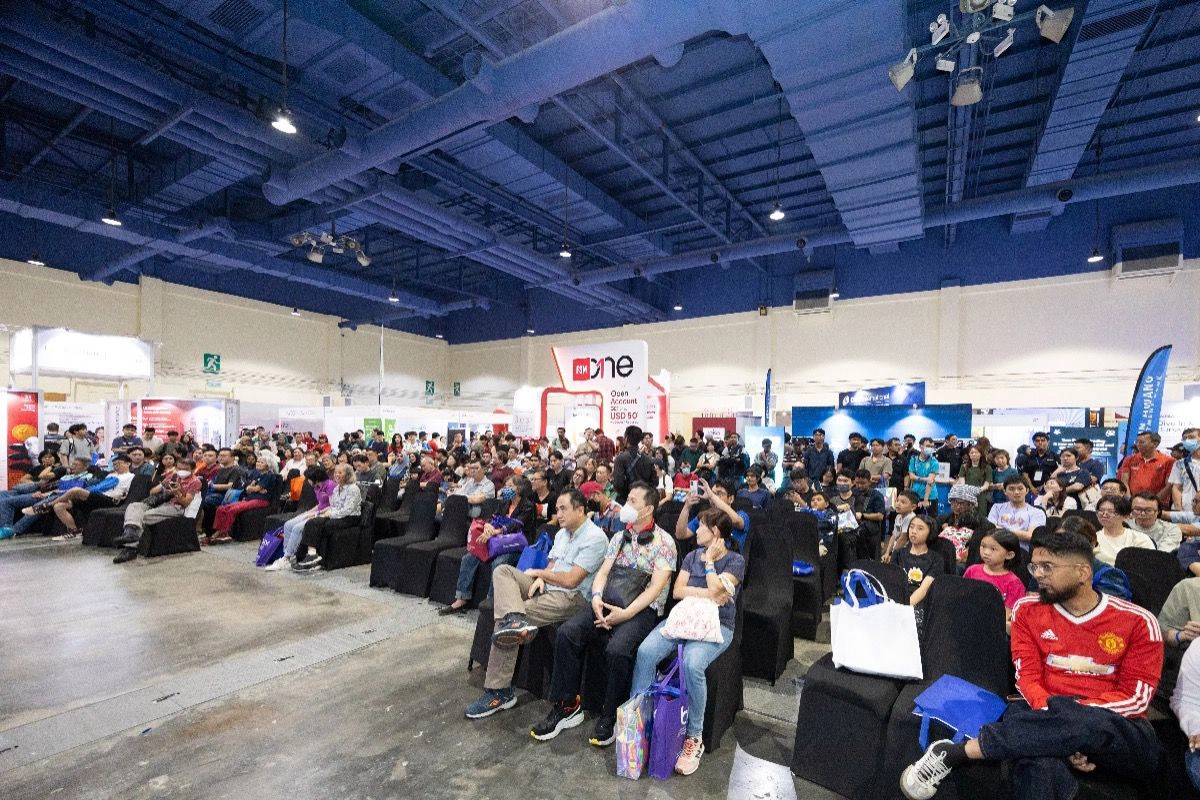 Visitors attend a presentation during INVEST Fair 2026 in Kuala Lumpur