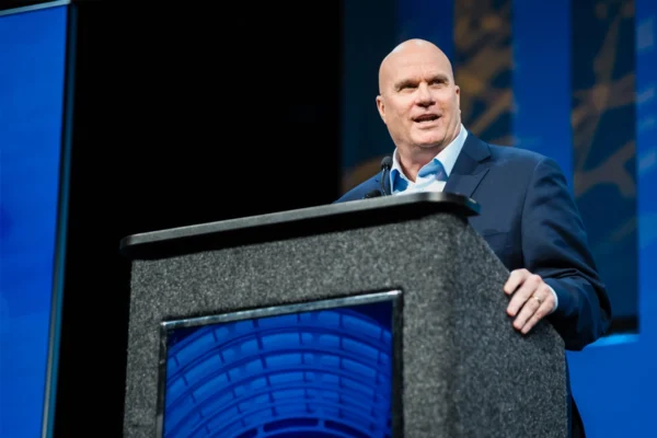 Brett C. Mitchell speaks at a podium during an IAVM event.
