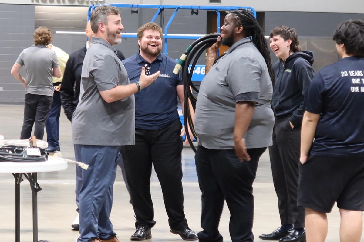SourceOne Events employees gather during a company training session