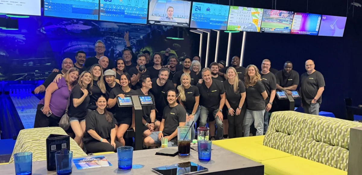 SourceOne Events employees gather during a team-building activity at SourceOne University