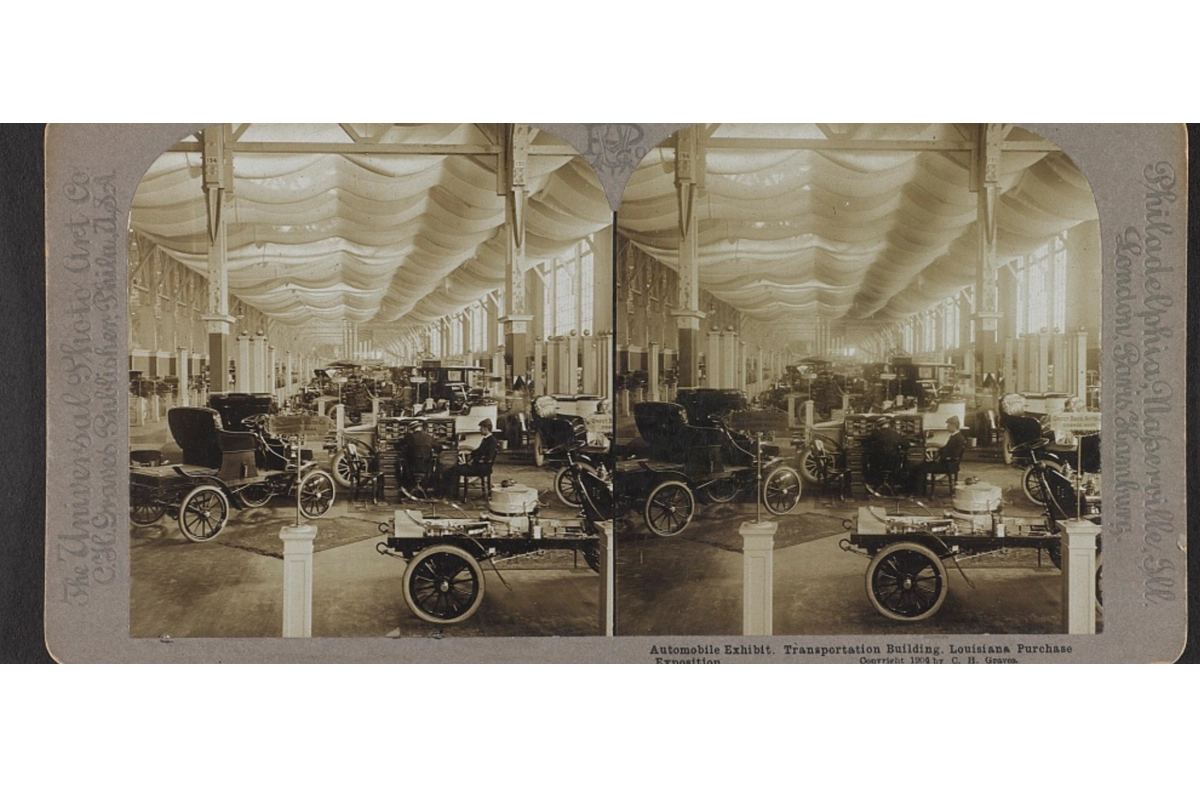 Stereograph showing automobiles displayed inside the Transportation Building at the 1904 Louisiana Purchase Exposition in St. Louis