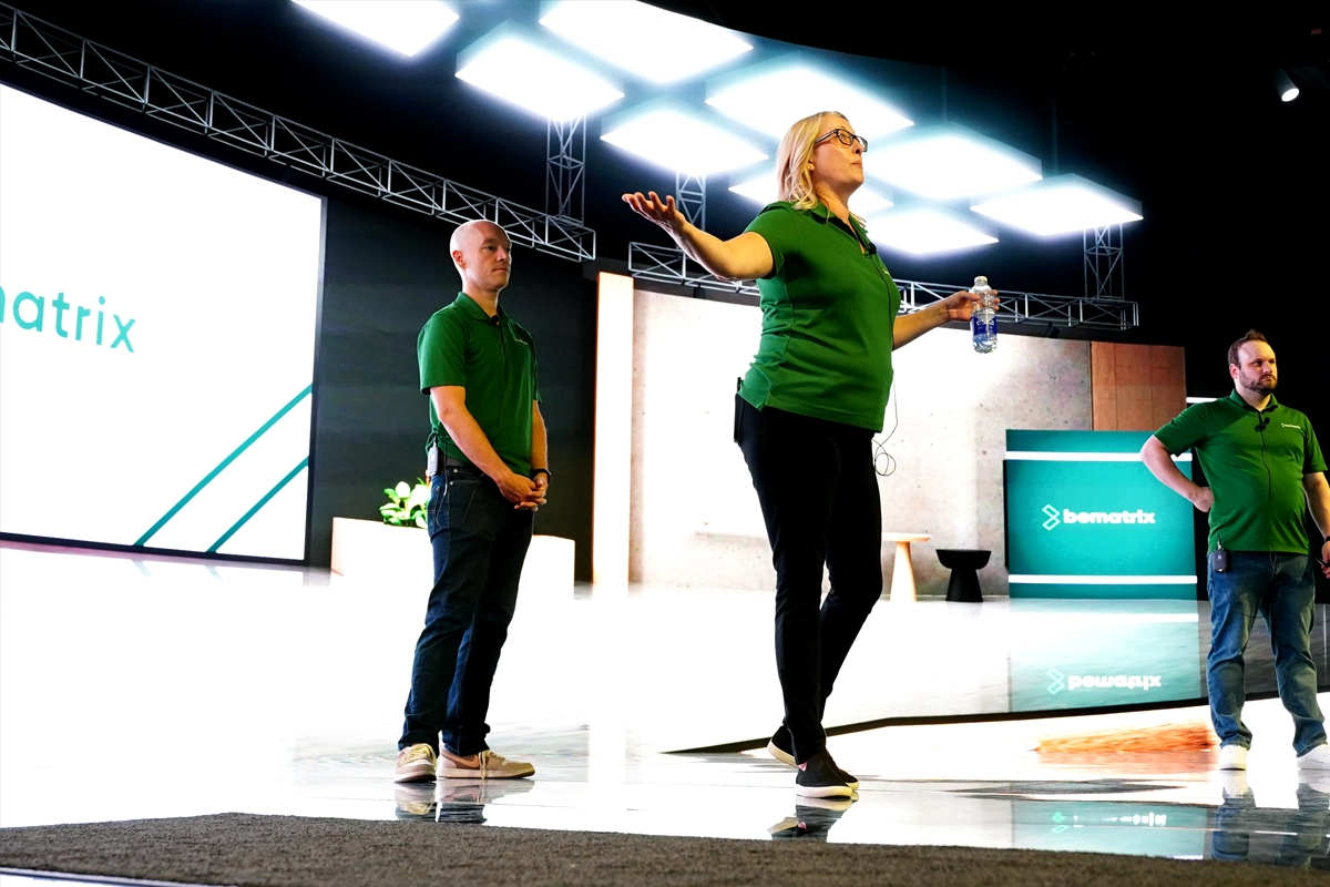 Three beMatrix presenters address attendees onstage at the Canadian beAcademy in Toronto.