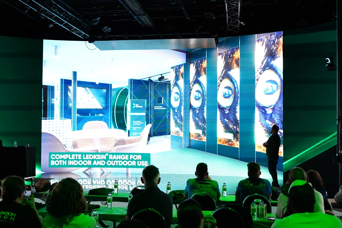 Attendees watch a presentation about beMatrix LEDskin displays at the Canadian beAcademy in Toronto.