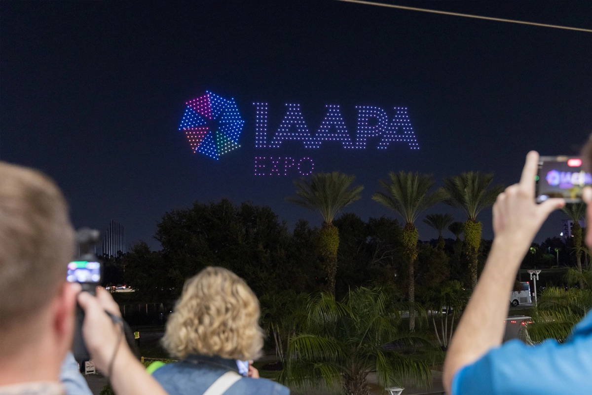 IAAPA Expo drone show forms the IAAPA Expo logo over Orlando at night