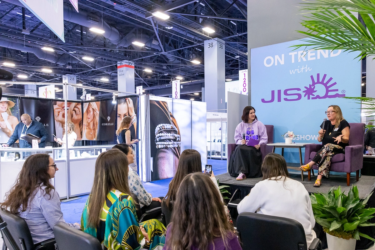 JIS education session with speakers and attendees on the show floor