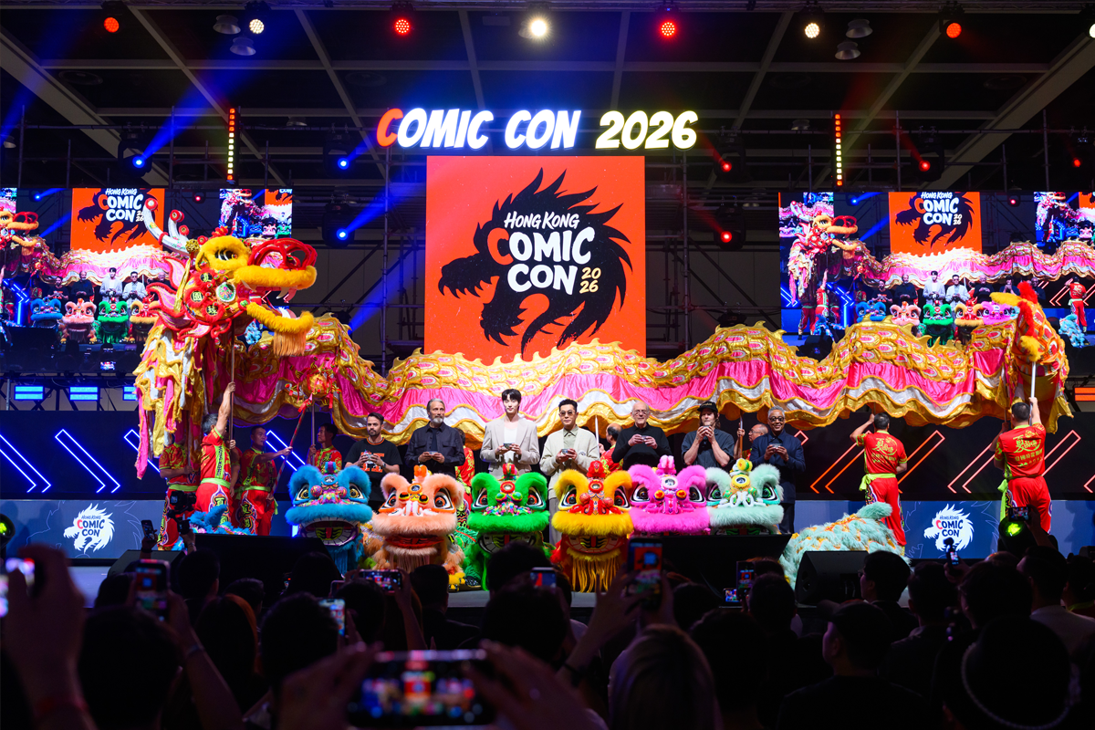 Participants gather onstage with colorful lion and dragon costumes beneath Hong Kong Comic Con 2026 signage.