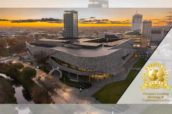 Te Pae Christchurch Convention Centre at sunset with a 2026 World Travel Awards winner badge.